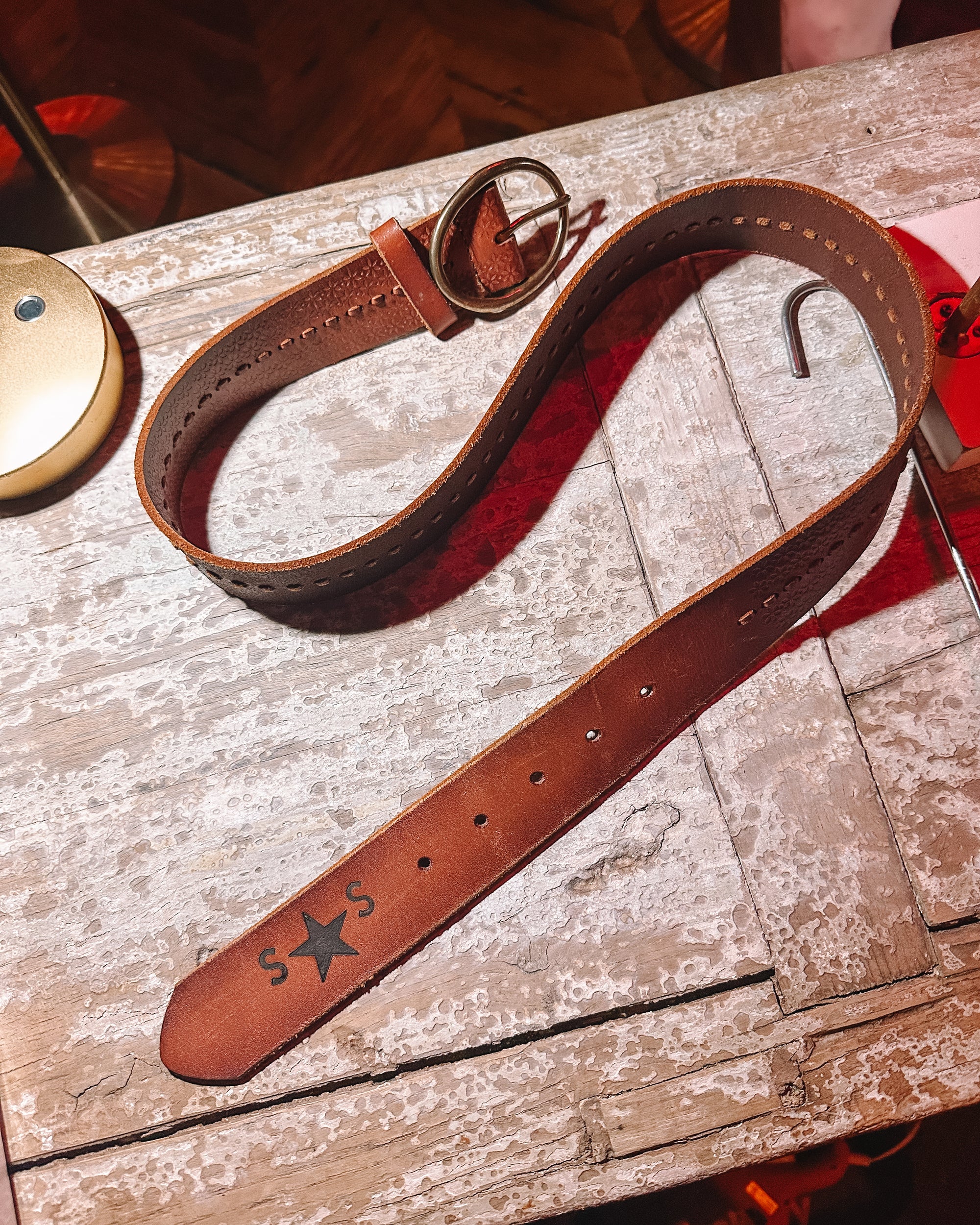 Custom leather belt with buckle at Bullet Boots Belt Bar in Denville NJ luxury custom belt bar experience for bachelorette parties corporate events and private group bookings handcrafted western leather accessories